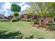 A spacious lawn complements the attractive brick exterior of this home, inviting outdoor enjoyment and relaxation at 216 Commodore Ct, Belmont, NC 28012
