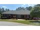 Charming brick home featuring manicured landscaping, a well-kept lawn, and classic architectural details at 216 Commodore Ct, Belmont, NC 28012