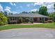 Charming brick home with a well-maintained lawn and mature landscaping at 216 Commodore Ct, Belmont, NC 28012
