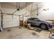 Attached garage with a gray SUV, and white garage doors with ceiling fans at 216 Commodore Ct, Belmont, NC 28012