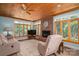 Inviting living room with a brick fireplace, large windows, and comfortable furnishings at 216 Commodore Ct, Belmont, NC 28012