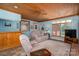 Cozy living room featuring a ceiling fan, comfortable seating, and ample natural light at 216 Commodore Ct, Belmont, NC 28012