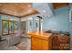 Bright living room with wood-paneled ceilings and a built-in bar area, perfect for entertaining at 216 Commodore Ct, Belmont, NC 28012