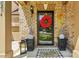 Eye-catching entryway with a cheerful wreath, stylish planters, and a welcoming 