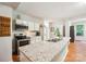 Modern kitchen with stainless steel appliances, granite countertops, and white cabinetry at 2254 Donnington Nw Ln, Concord, NC 28027