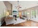 Spacious living room with vaulted ceilings, fireplace, hardwood floors, and stylish neutral furniture at 2254 Donnington Nw Ln, Concord, NC 28027
