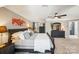 Large main bedroom boasts ample space, dark wood furniture, and neutral carpeting at 2254 Donnington Nw Ln, Concord, NC 28027