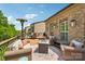 Spacious outdoor living area with comfortable seating, a fire pit, and a manicured lawn at 2254 Donnington Nw Ln, Concord, NC 28027