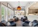 Cozy sitting area with comfortable chairs, natural light, and views into the adjacent kitchen at 2254 Donnington Nw Ln, Concord, NC 28027