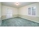 Bedroom with shuttered windows, painted walls, green carpet, and decorative molding at 2643 Rolling Hills Dr, Monroe, NC 28110