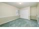 Bright bedroom with green carpet, window with blinds, and a double-door closet at 2643 Rolling Hills Dr, Monroe, NC 28110