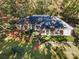 Brick home with landscaping, mature trees, and a lush green lawn at 2643 Rolling Hills Dr, Monroe, NC 28110