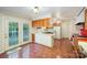 Open-concept kitchen featuring wood cabinets and french doors that lead to the deck at 2643 Rolling Hills Dr, Monroe, NC 28110