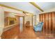 Spacious living room featuring a brick fireplace, hardwood floors, and wood accents at 2643 Rolling Hills Dr, Monroe, NC 28110