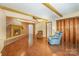 Cozy living room with hardwood floors, brick fireplace, and comfortable seating at 2643 Rolling Hills Dr, Monroe, NC 28110