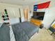 Comfortable bedroom with sports decor, featuring a bed and dresser at 2752 Sawbridge Ln, Gastonia, NC 28056