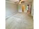 Bright bedroom featuring neutral walls, carpet flooring, a ceiling fan, and doorways to additional rooms at 2752 Sawbridge Ln, Gastonia, NC 28056