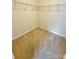 Empty walk in closet featuring neutral walls, carpet flooring, and built-in shelving for organized storage at 2752 Sawbridge Ln, Gastonia, NC 28056