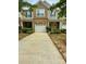 Charming townhome with a brick facade and a one-car garage at 2752 Sawbridge Ln, Gastonia, NC 28056