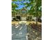 Charming townhome featuring a well-manicured lawn, brick accents, and a private driveway leading to an attached garage at 2752 Sawbridge Ln, Gastonia, NC 28056