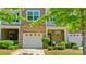 Charming townhome boasting brick accents, a one-car garage, and a cozy front entrance with a delightful garden at 2752 Sawbridge Ln, Gastonia, NC 28056