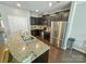Contemporary kitchen with granite countertops, stainless steel appliances, and stylish dark cabinets at 2752 Sawbridge Ln, Gastonia, NC 28056