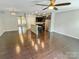 Open-concept living area with hardwood floors and stainless steel appliances at 2752 Sawbridge Ln, Gastonia, NC 28056