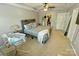 Comfortable main bedroom with tray ceiling, fan, and a door to the walk-in closet at 2752 Sawbridge Ln, Gastonia, NC 28056