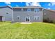 Spacious green backyard featuring a well-maintained lawn and a view of the home's exterior at 3022 Oakmere Rd, Waxhaw, NC 28173