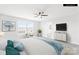 This staged bedroom features large windows and a ceiling fan at 3022 Oakmere Rd, Waxhaw, NC 28173