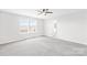 A bright bedroom features lots of natural light and neutral carpet at 3022 Oakmere Rd, Waxhaw, NC 28173