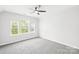 Bedroom featuring large windows and a ceiling fan at 3022 Oakmere Rd, Waxhaw, NC 28173