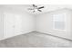 Bedroom featuring a ceiling fan, a large window, and a closet at 3022 Oakmere Rd, Waxhaw, NC 28173