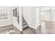 Welcoming foyer area with beautiful floors, stairway, and a view into the home's living spaces at 3022 Oakmere Rd, Waxhaw, NC 28173