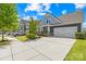 Beautiful home with a two-car garage, expansive driveway, nice landscaping, and a welcoming front porch at 3022 Oakmere Rd, Waxhaw, NC 28173