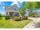 Charming home featuring manicured lawn, lovely landscaping, inviting front porch, and beautiful curb appeal at 3022 Oakmere Rd, Waxhaw, NC 28173