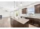 Gourmet kitchen with granite counters, stainless appliances and an island with pendant lighting at 3022 Oakmere Rd, Waxhaw, NC 28173