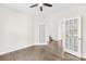 Bright, open room features hardwood floors, French doors, and a ceiling fan at 3022 Oakmere Rd, Waxhaw, NC 28173