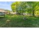 Sprawling backyard that features mature trees, a fire pit, and an outdoor living space at 304 W Fourth St, Cherryville, NC 28021