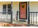 Welcoming front porch with flowers, 'WELCOME' sign, and house number 304 by the door at 304 W Fourth St, Cherryville, NC 28021