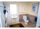 Neutral bathroom showcasing tiled walls, accessible handrails, and classic fixtures and design at 310 4Th W St, Newton, NC 28658