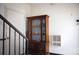 Interior shot featuring a wooden cabinet, white walls, and a glimpse of a staircase with white risers at 310 4Th W St, Newton, NC 28658