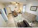 Bright living room with multiple seating arrangements, a dining area, and visible access to adjacent rooms at 310 4Th W St, Newton, NC 28658