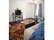 Cozy living space with a couch, colorful rug, mini fridge, and ample room for relaxing and entertaining at 310 4Th W St, Newton, NC 28658