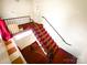 Carpeted staircase with metal railing and good visibility, offering safe access between levels at 310 4Th W St, Newton, NC 28658