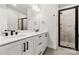 Bathroom featuring a double sink vanity with black hardware and a glass-enclosed shower at 3223 Beans Blvd, Charlotte, NC 28203