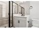 Modern bathroom featuring a glass enclosed shower, vanity with sink, and a toilet at 3223 Beans Blvd, Charlotte, NC 28203