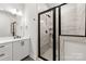 Modern bathroom showcasing a tiled walk-in shower with glass enclosure, sleek fixtures, and a vanity at 3223 Beans Blvd, Charlotte, NC 28203