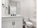 Bright bathroom featuring white vanity, sink, toilet and combination tub and shower at 3223 Beans Blvd, Charlotte, NC 28203