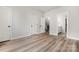 Bright bedroom with two doors, laminate flooring and access to an ensuite bathroom at 3223 Beans Blvd, Charlotte, NC 28203